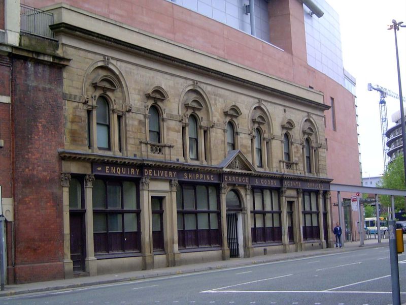 At one end of the station the obsolete and truncated freight station survives, or at least its facade survives, either by accident or intent