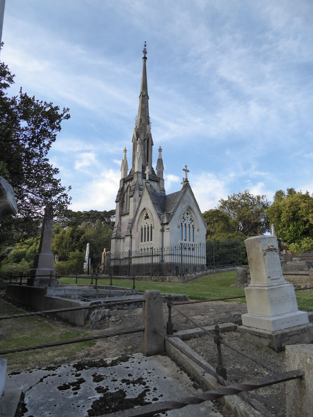 The fanciest monument is this one, with its very own miniature representation of the First Presbyterian Church. It houses William Harnach, a
