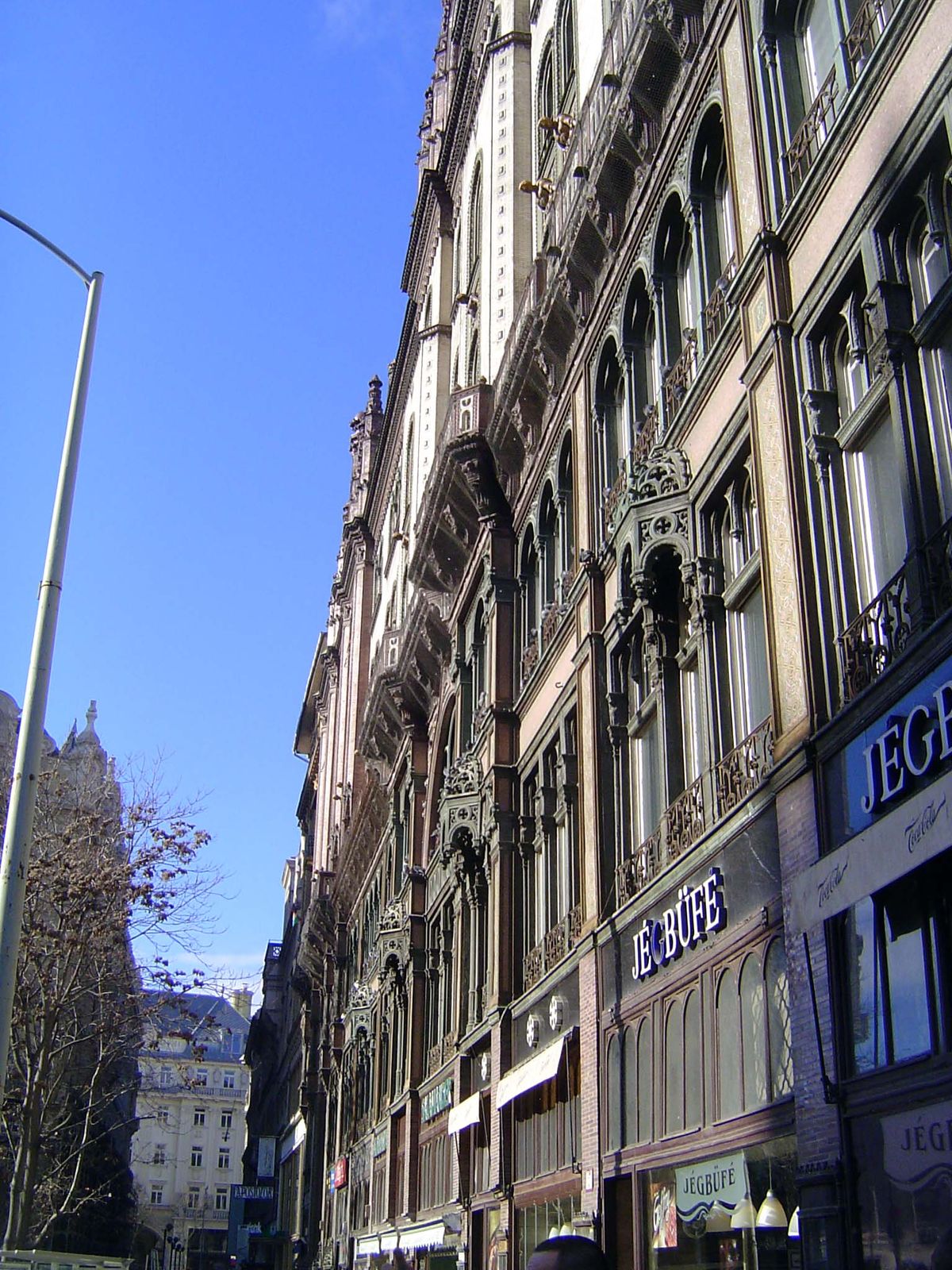 The architects at work here today refer to the building as in "Venetian Gothic with Islamic elements."