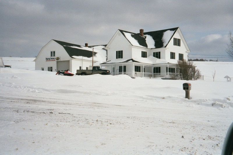 Rivers in snow, roads in snow: time for an iconic house in the snow. That's a potato barn out back: storage for a lot more than you can eat 