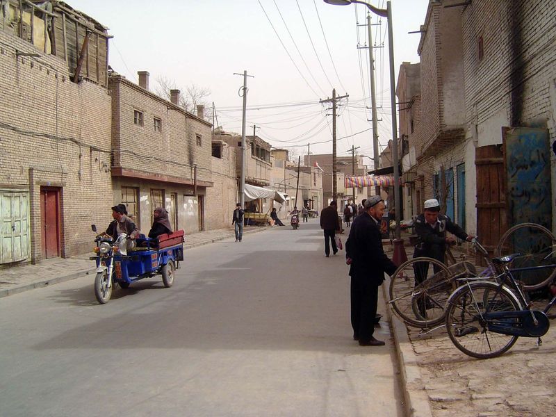 A main street in a mostly residential area. Things are already much changed from what Catherine Macartney saw. She wrote, "The streets of th