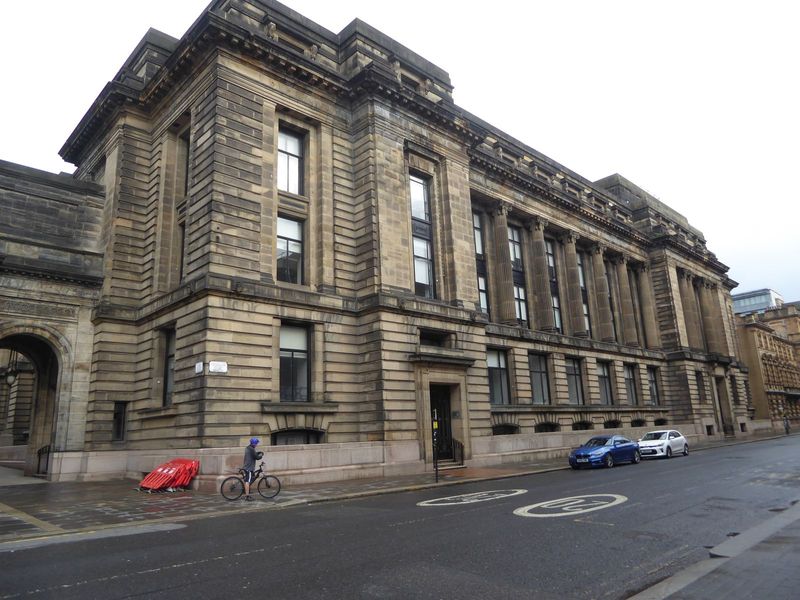 The City Chambers soon proved too small and by 1914 this depressingly sober extension or east block had been added.
