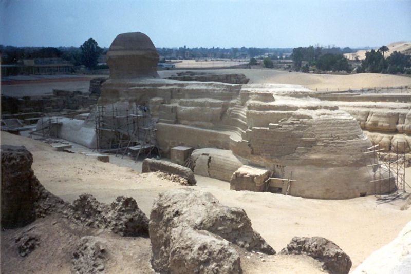 A less familiar view, revealing the volume of rock quarried from her flanks. The Sphinx faces east, looking toward the rising sun. Why? She 