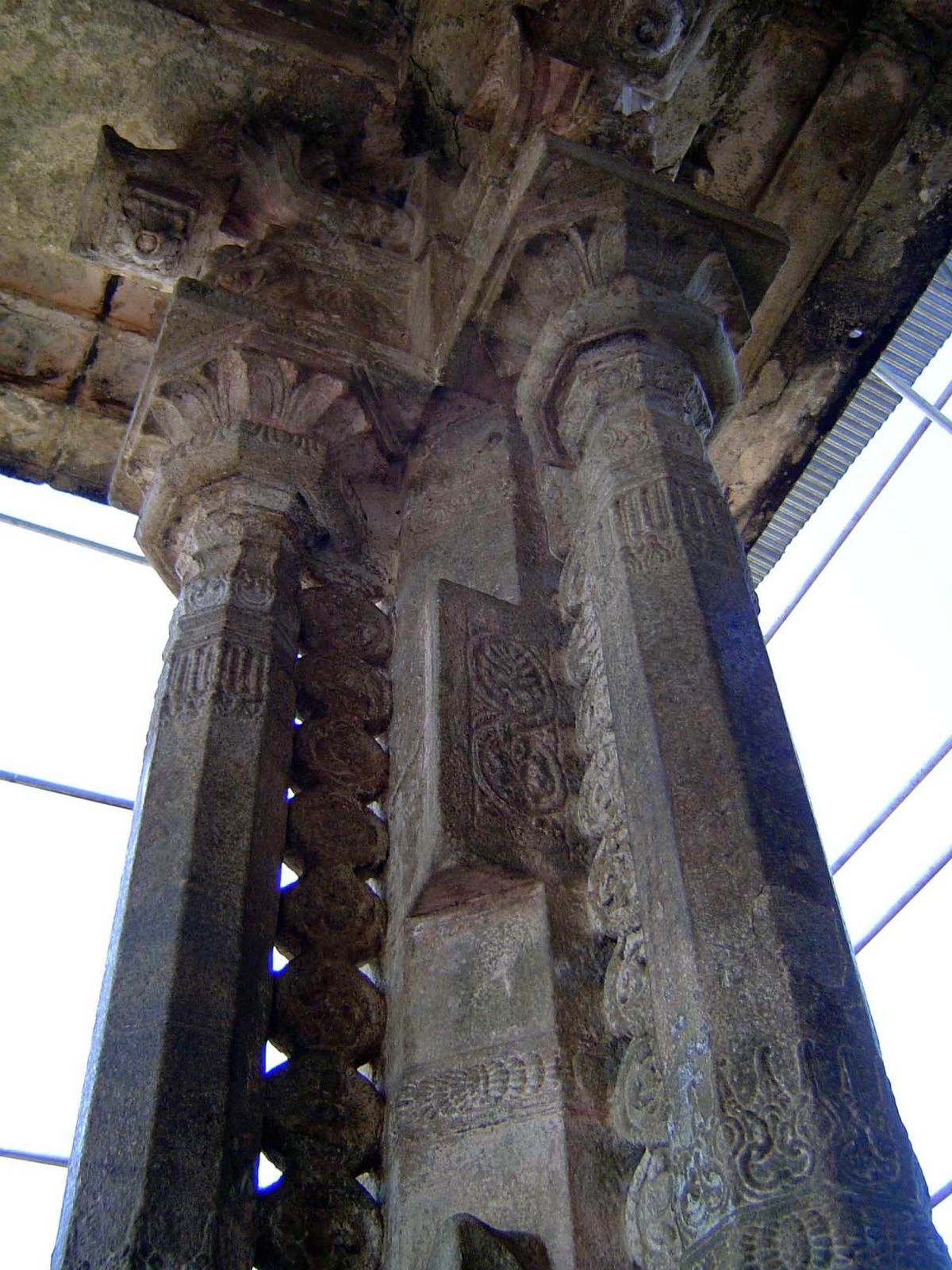 It's a tri-column monolith, one of two holding up the heavy stone-slab roof.