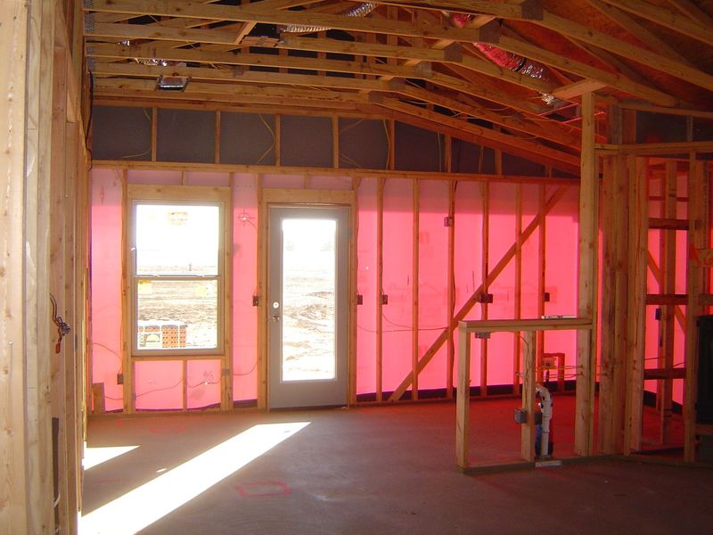 The space between studs will be insulated with fiberglass batting. There will an external veneer and internal drywall. That's it. Looks like