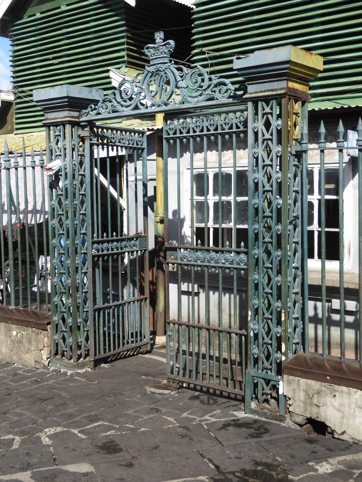 A gate to the bazaar carries those initials found in so many ex-British countries: VR.