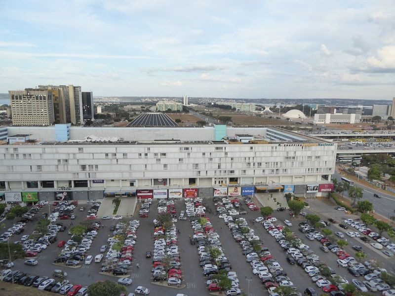 Here's that same shopping center. Behind it, the ribbed roof of the national theater. On the right, in the distance, are the iconic twin tow