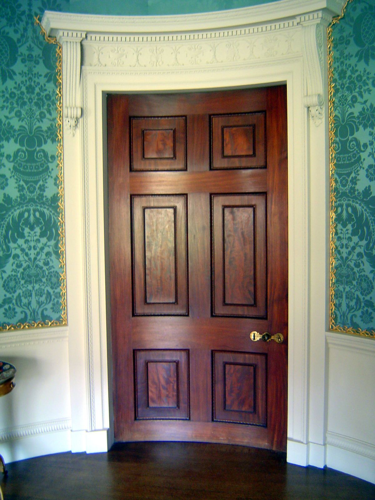 Massive doors are perfectly curved to fit elliptical rooms.