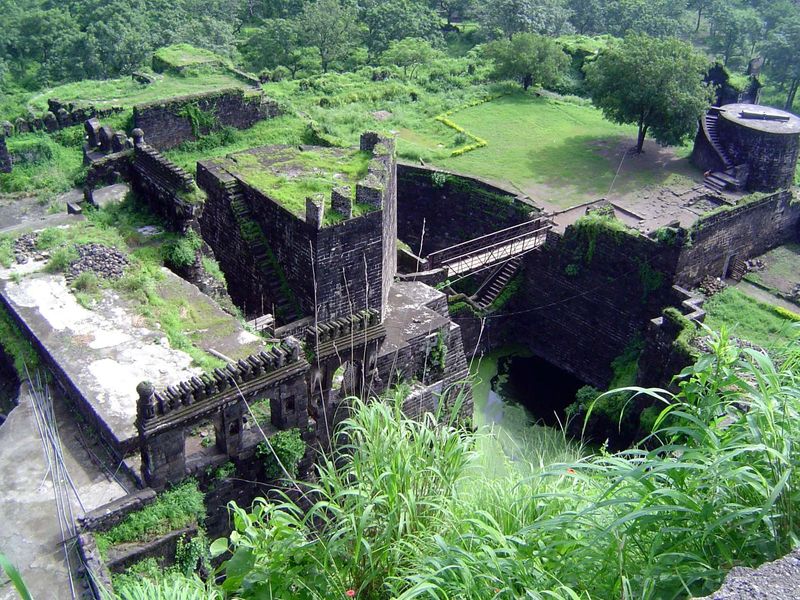 We've returned to the spot where we first saw the moat, but now we're looking down, so we've obviously surmounted the cliff. How? The iron-a