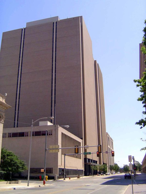 Talk about getting architecturally blackjacked: the Pioneer Building, in the distance, is overpowered by the nearly windowless hulk of a lat