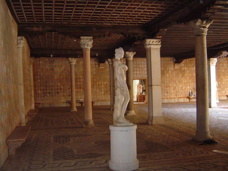 The ground level, with the courtyard in the sun; above is the piano nobile.