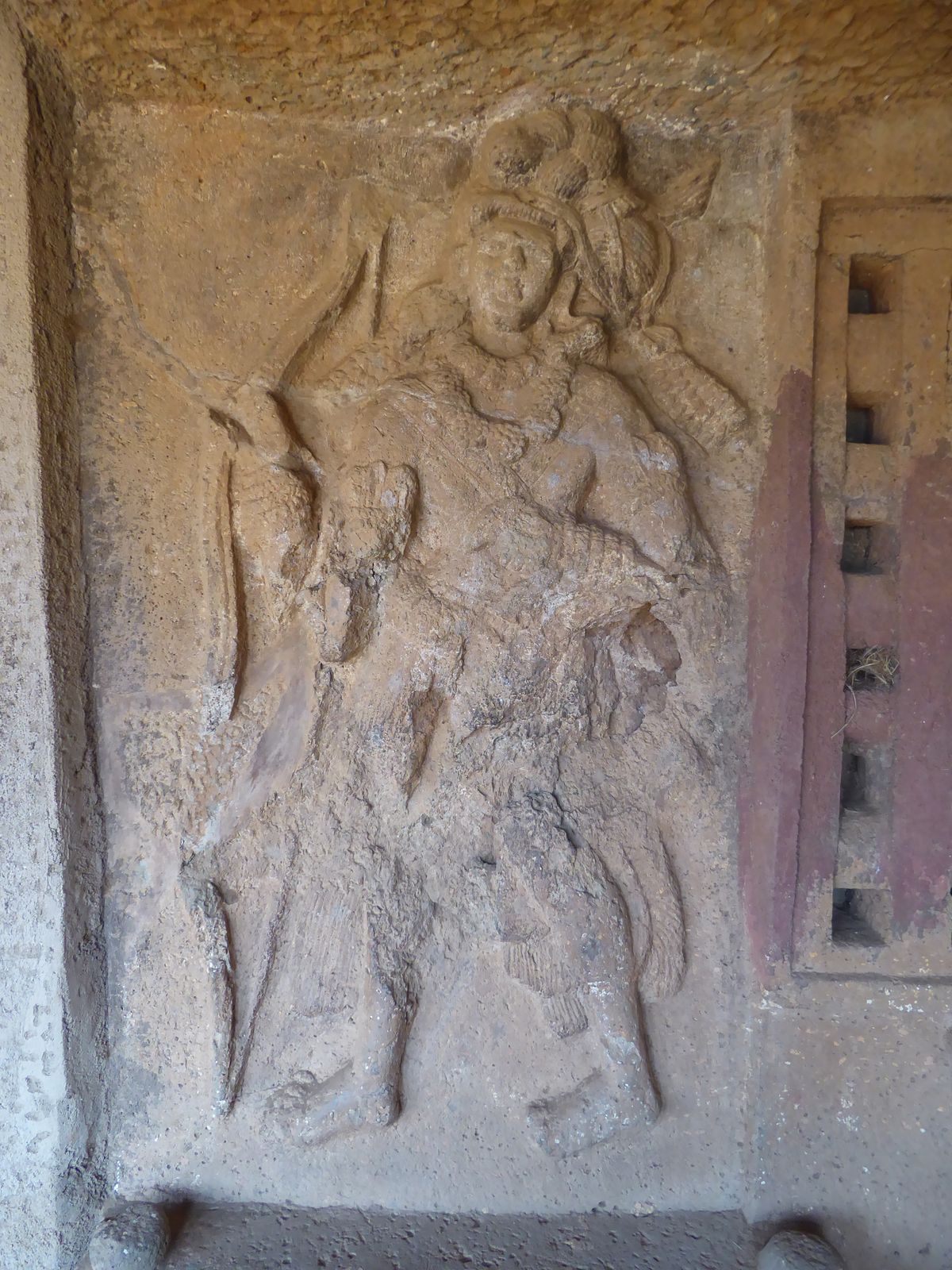Another figure in the group.