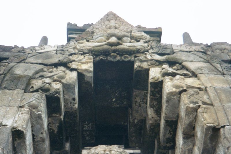 Climbing the stairs, you walk into the mouths of kala, a jawless creature associated with immortality. For other depictions, see Cambodia: A