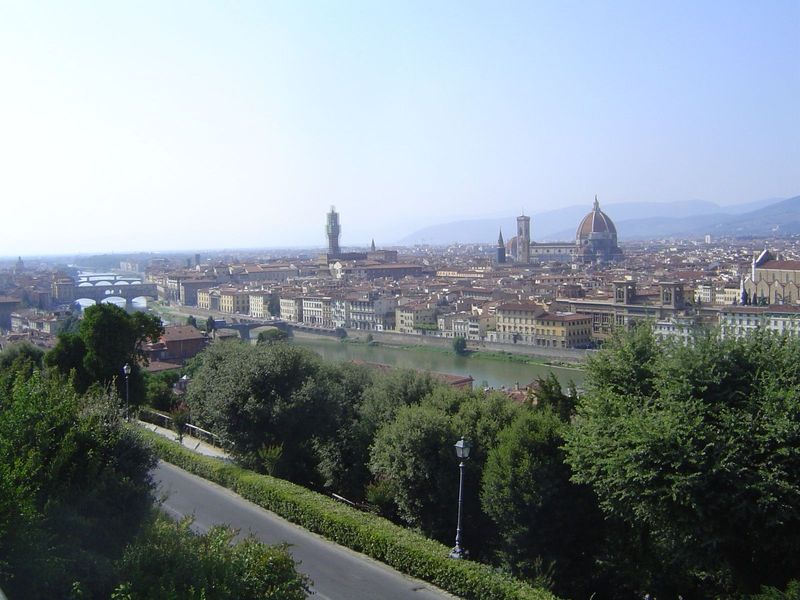 This picture was taken from the Piazzale Michelangelo. The three buildings rising above the skyline are the Palazzo Vecchio, which flanks th