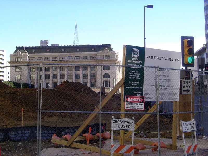 A park is in order; several, in fact, mostly on parking lots but in this case on top of a new underground garage. In the distance is the old