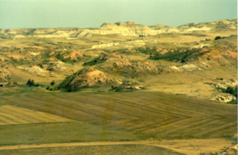 Cultivated land extends to the very break of the plains.