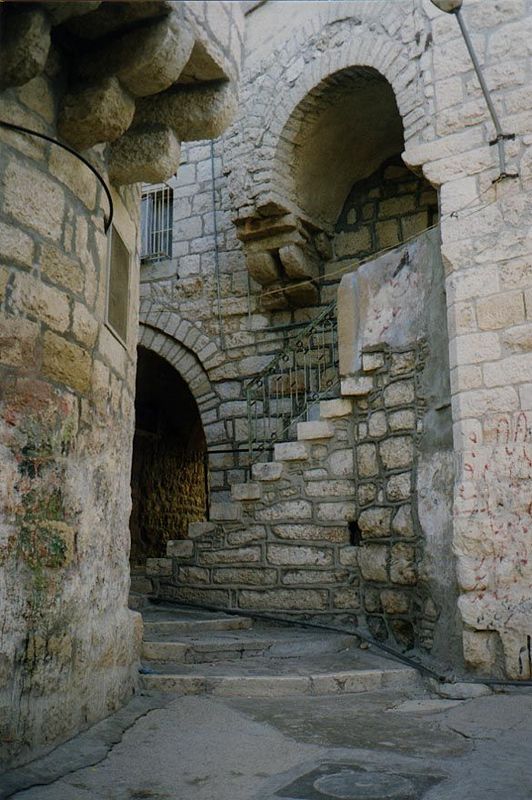 Close to the Church of the Nativity, this corner belongs to somebody who wants to care for it, but the mortar appears to be concrete, not li