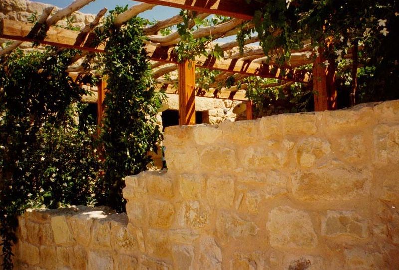 A pergola over a room's courtyard.