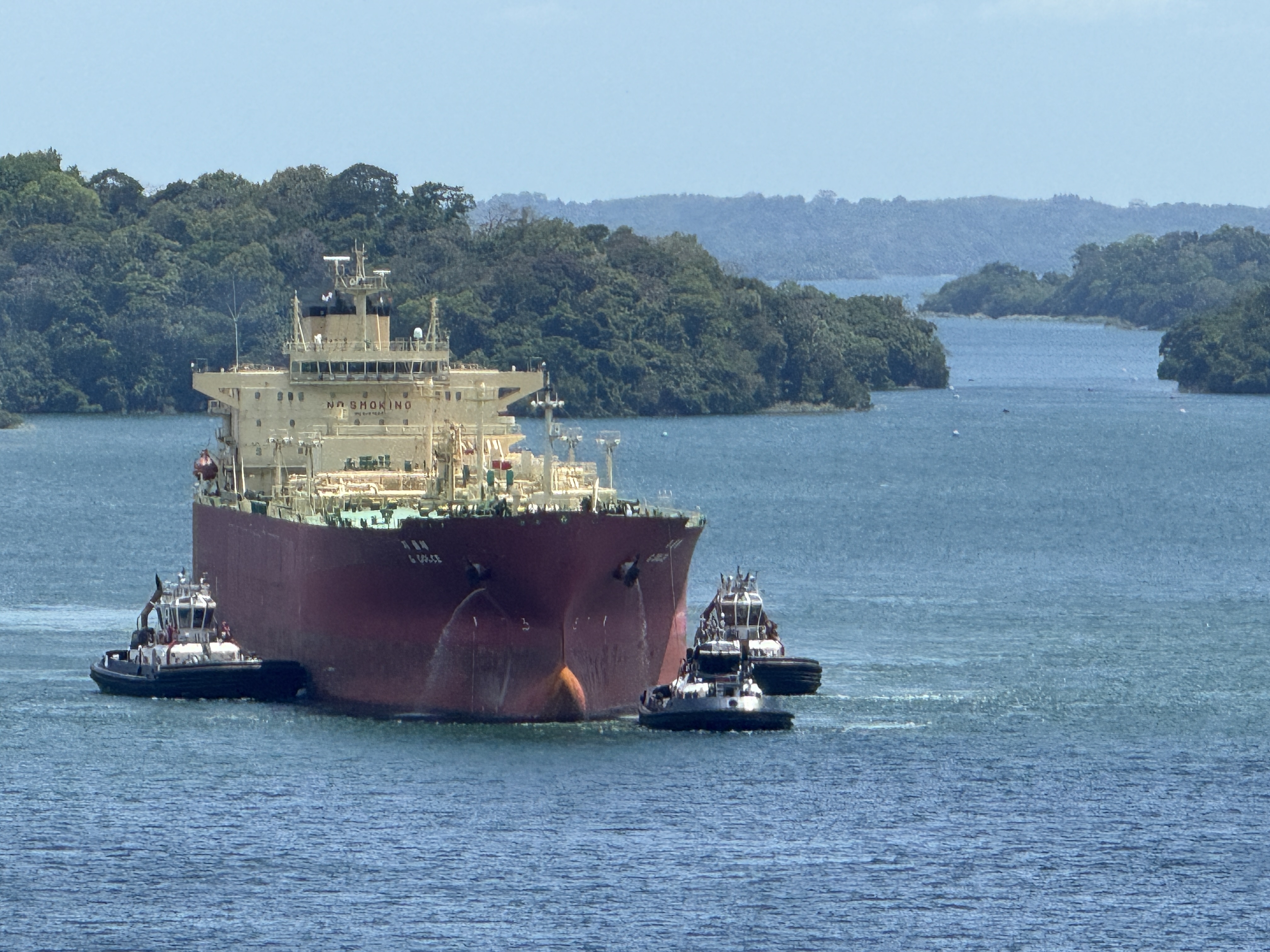 And here, back at the lake, tugs guide a ship into the Gatun Locks.  Well, that's not quite true.  They're guiding it toward the Agua Clara 
