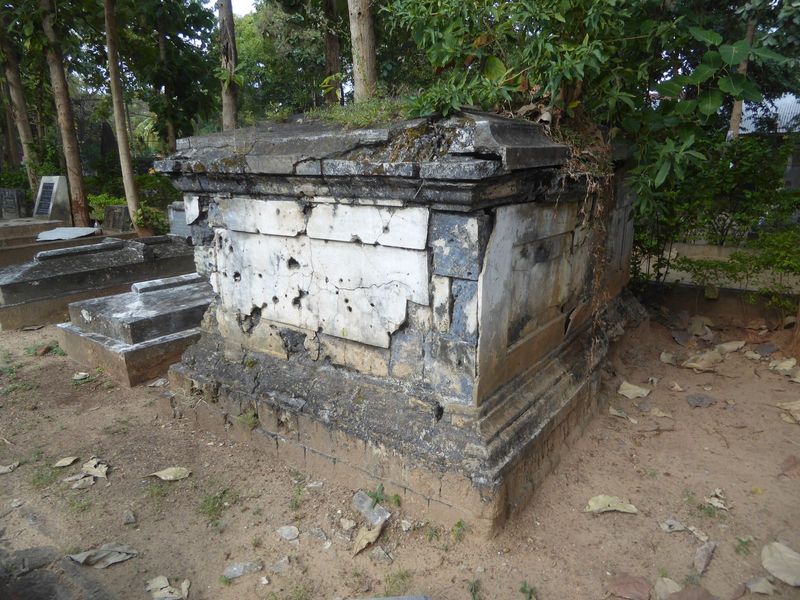 There's a cemetery near the church. It's locked, but where there's a will. And look! From its size, this might by Dyke's tomb. He was certai