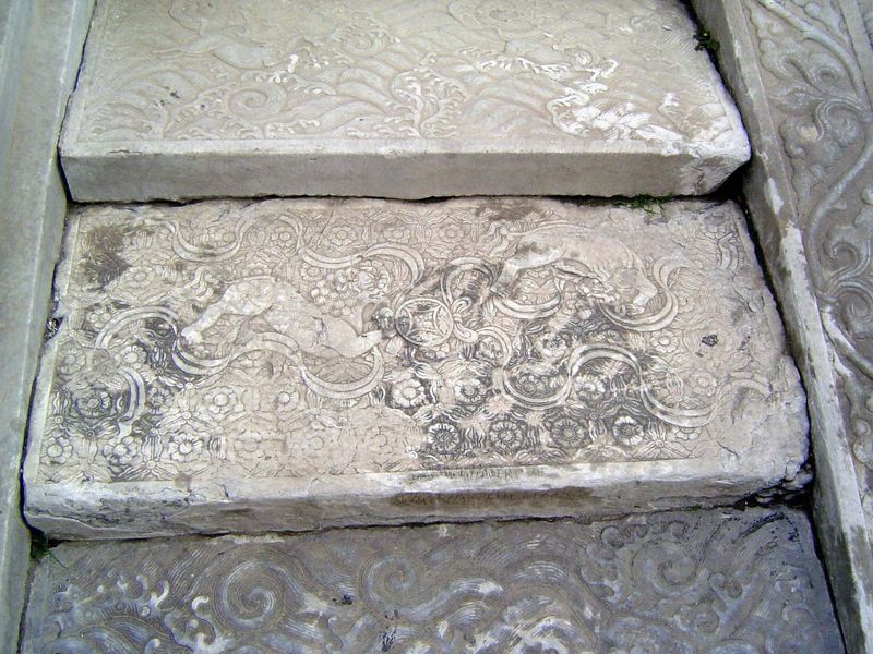 The flanking steps are carved, too, in this case with lions and horses.