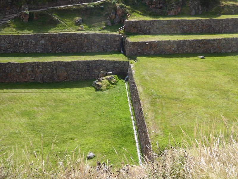 So the longitudinal ditch comes down the side, then makes a right-angle turn, drops, and flows along the base of a terrace wall. In 1913, wh