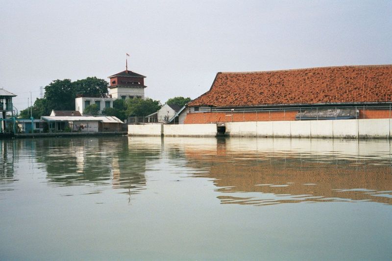 This picture was taken near the schooners shown in the previous chapter and looks south toward a Dutch lookout tower. The Pasar Ikan or cove