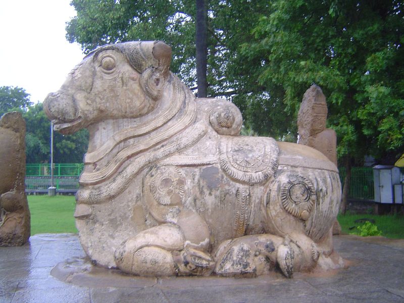 Nandi recently repaired is not unlike a figure on a carousel. The pillars on either side suggest that a roof must have existed or at least b