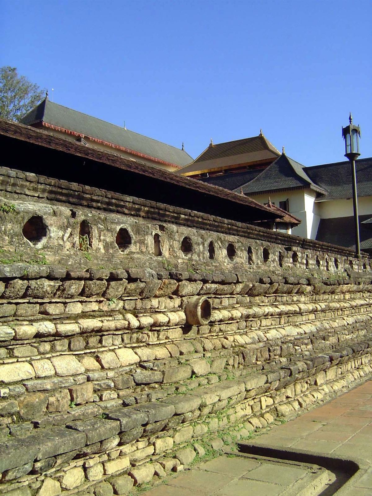 The temple wall has a classic profile. It was once plastered and whitewashed, unfortunate as that may seem to modern eyes fond of the underl