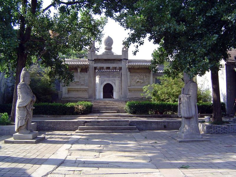 The path leads past a pair of statues of military and civil officers, much like those on the Sacred Way at the Ming tombs.