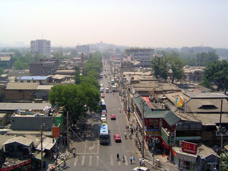 An axial street runs south to Jingshan, lost in the haze.