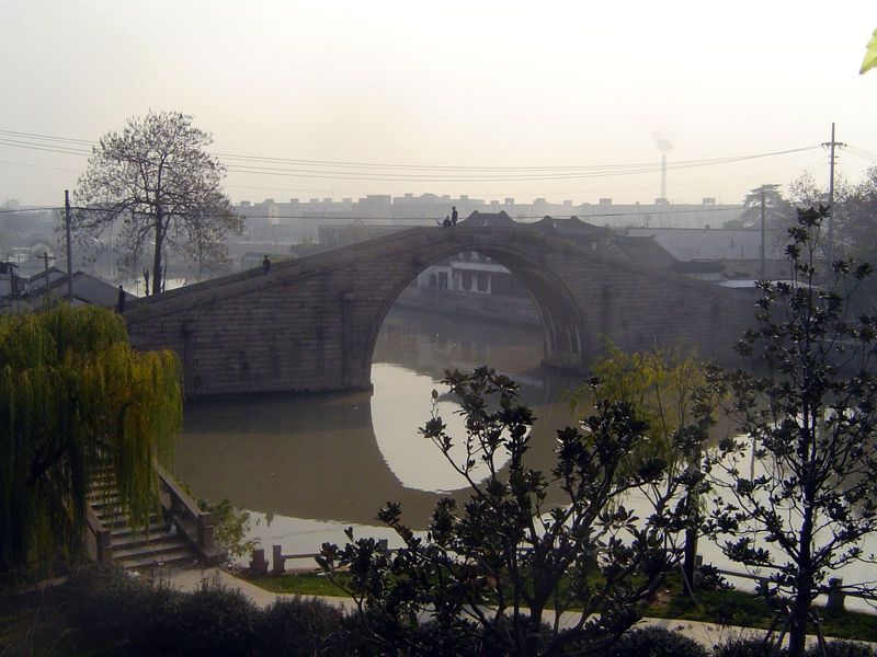 Wumen. The moat here sends off a branch to the left, where it flows through a water gate in the city wall. The city is fifty miles from the 