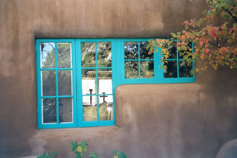 Nearby, a window in one of the "Cinco Pintores" houses. The name comes from five young men who about 1920 came to Santa Fe to paint. They al