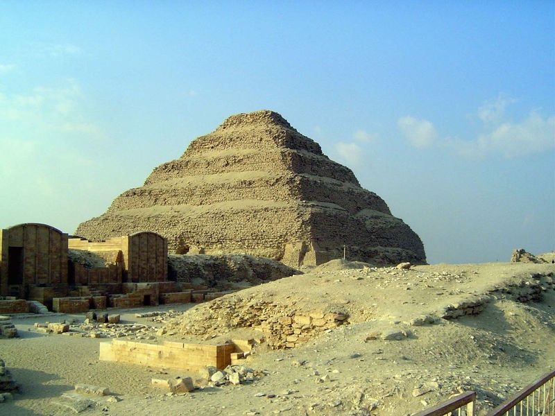 Well over 200 feet high, it rises in seven steps over an underground mastaba, a rectangular flat tomb whose form imitates a mud-brick house.