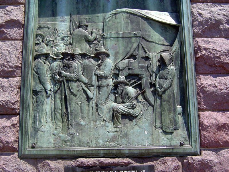 On the platform supporting the statue, bronzes recount the national story of the Boers, driven inland by the advancing British.