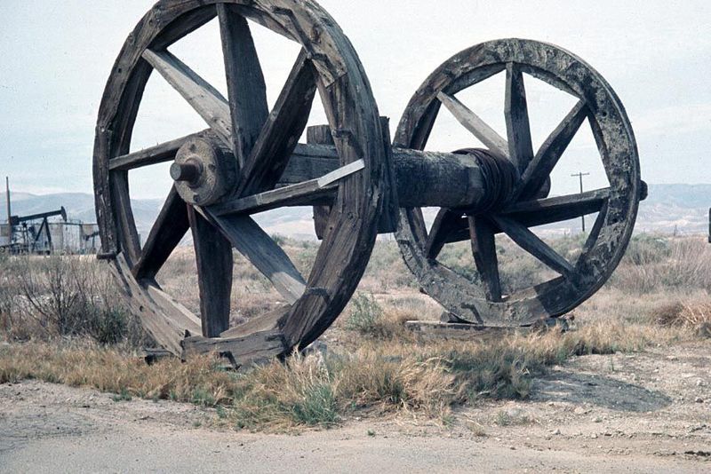 These are bullwheels, giant spools on which drilling cable was wound in the days of percussion-tool drilling.