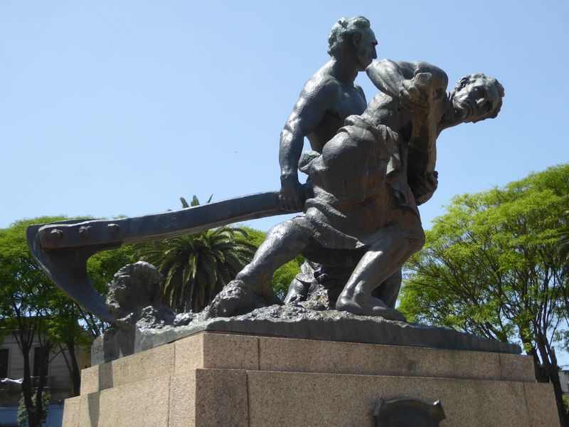 A monument in the town square recalls pioneer labor.