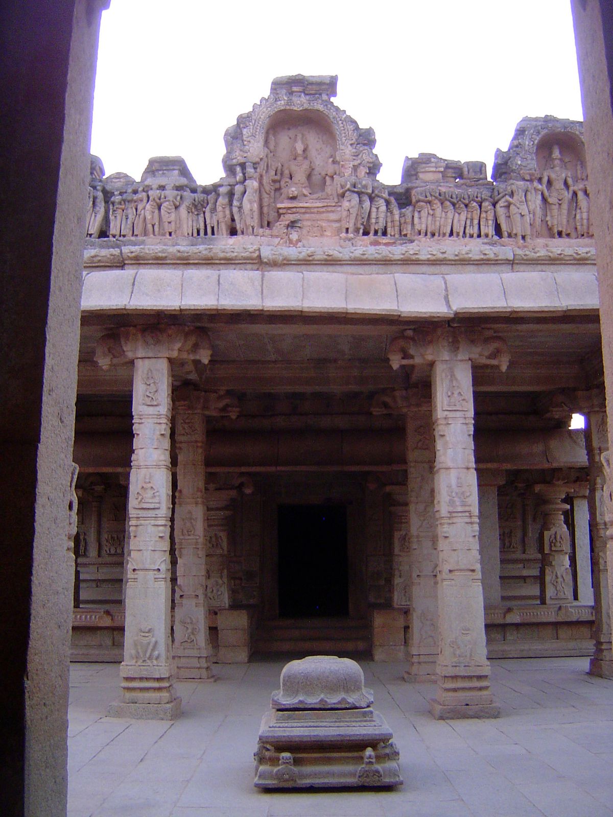 Flanked by courtiers, Rama is shown with Sita.