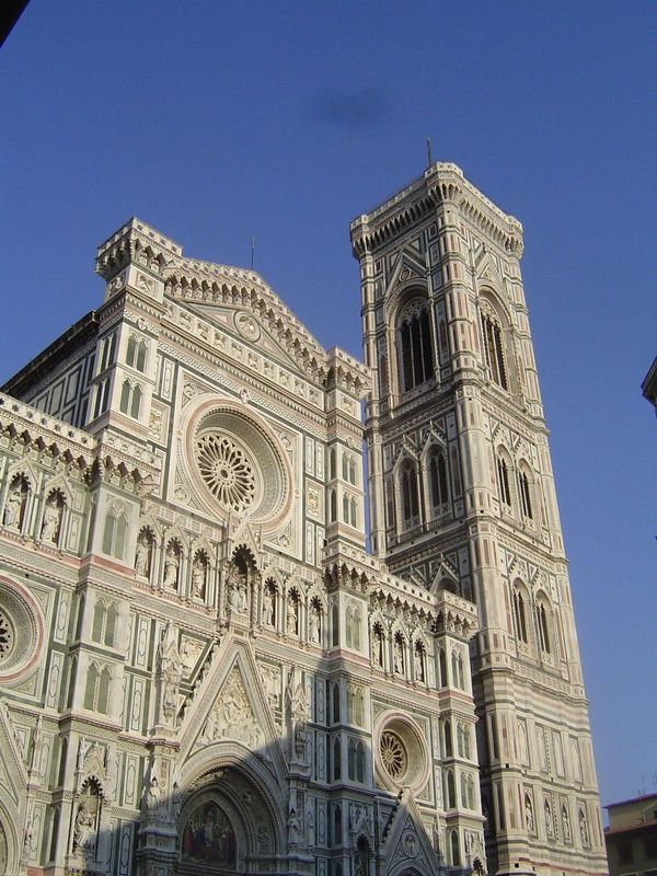 This is Santa Maria del Fiore, Florence's cathedral. It was begun in 1296 and has a Latin-cross design laid out by Arnolfo de Cambio. The do