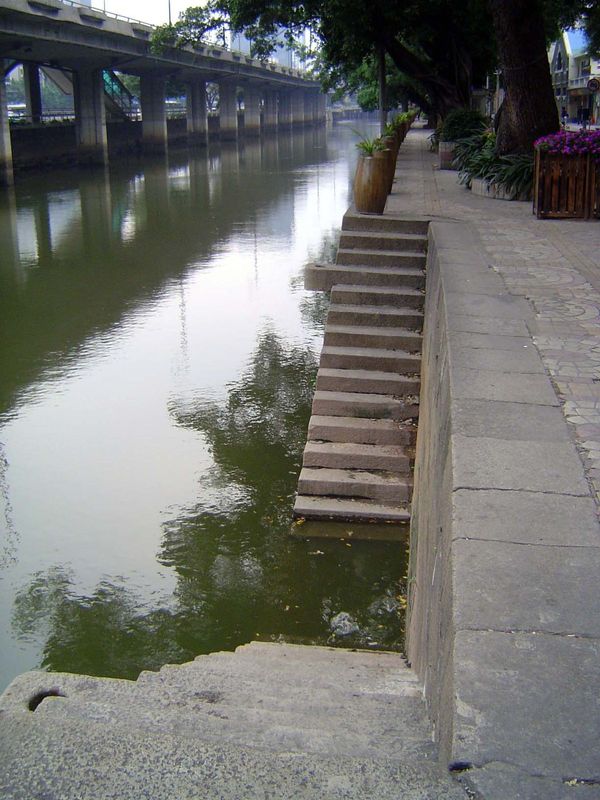 Steps up from the Embankment. With heavy gates shut at night on the bridges, and with guards stationed there during the day to allow no Chin