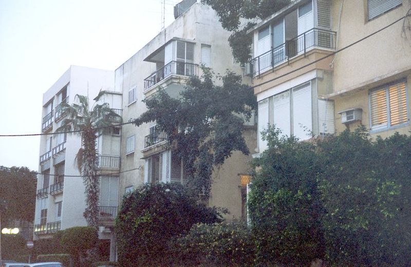 Upscale flats in the central city. That slightly worn look is characteristic, as is the masking vegetation.
