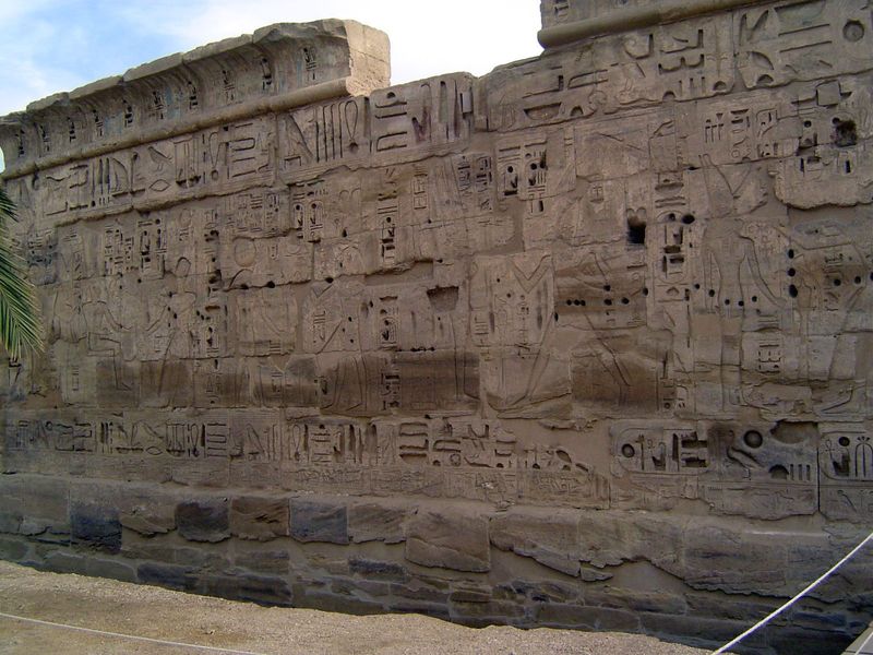 The building they're working on is the small Amun Temple, begun in the reign of Hatshepsut. Defaced, it was restored and decorated by order 