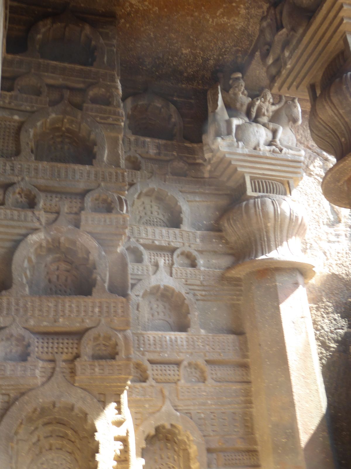 The sides of the porch are covered with the rail pattern and chaitya window ornaments. Burgess again: "This and the complete absence of any 