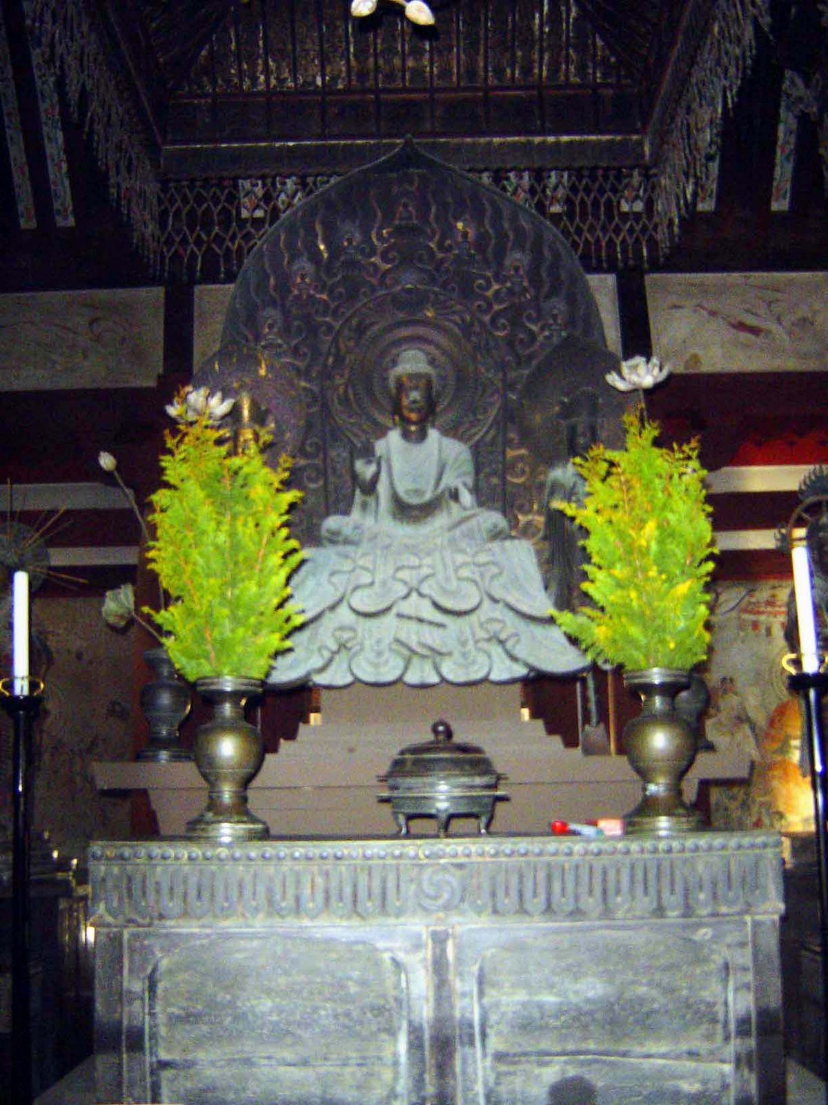 Inside the kondo, the Shaka Sanskrit = Shakyamuni Triad centers on a small bronze 7th-century image of the historic Buddha.