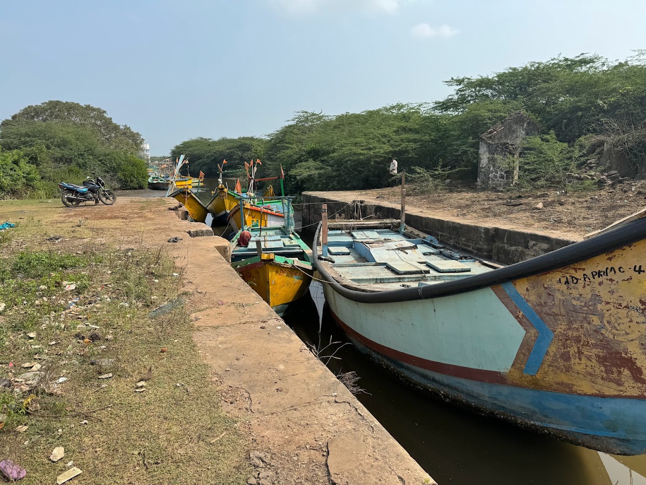 We're deep in the delta, where boats are still in use on the canals near Bandar Port, a name that can join the Sierra Mountains, Sahara Dese