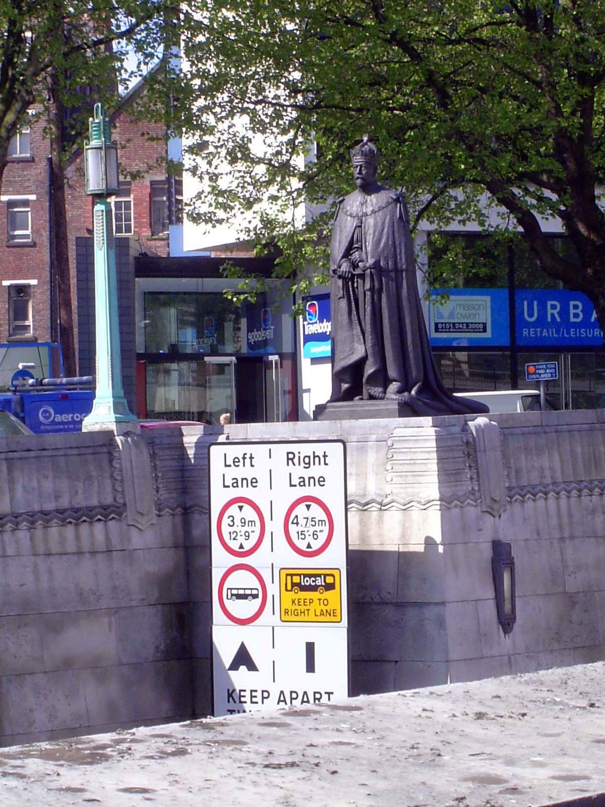 Probably annoyed by the task assigned to him, George V keeps an eye on traffic entering the Mersey Tunnel.