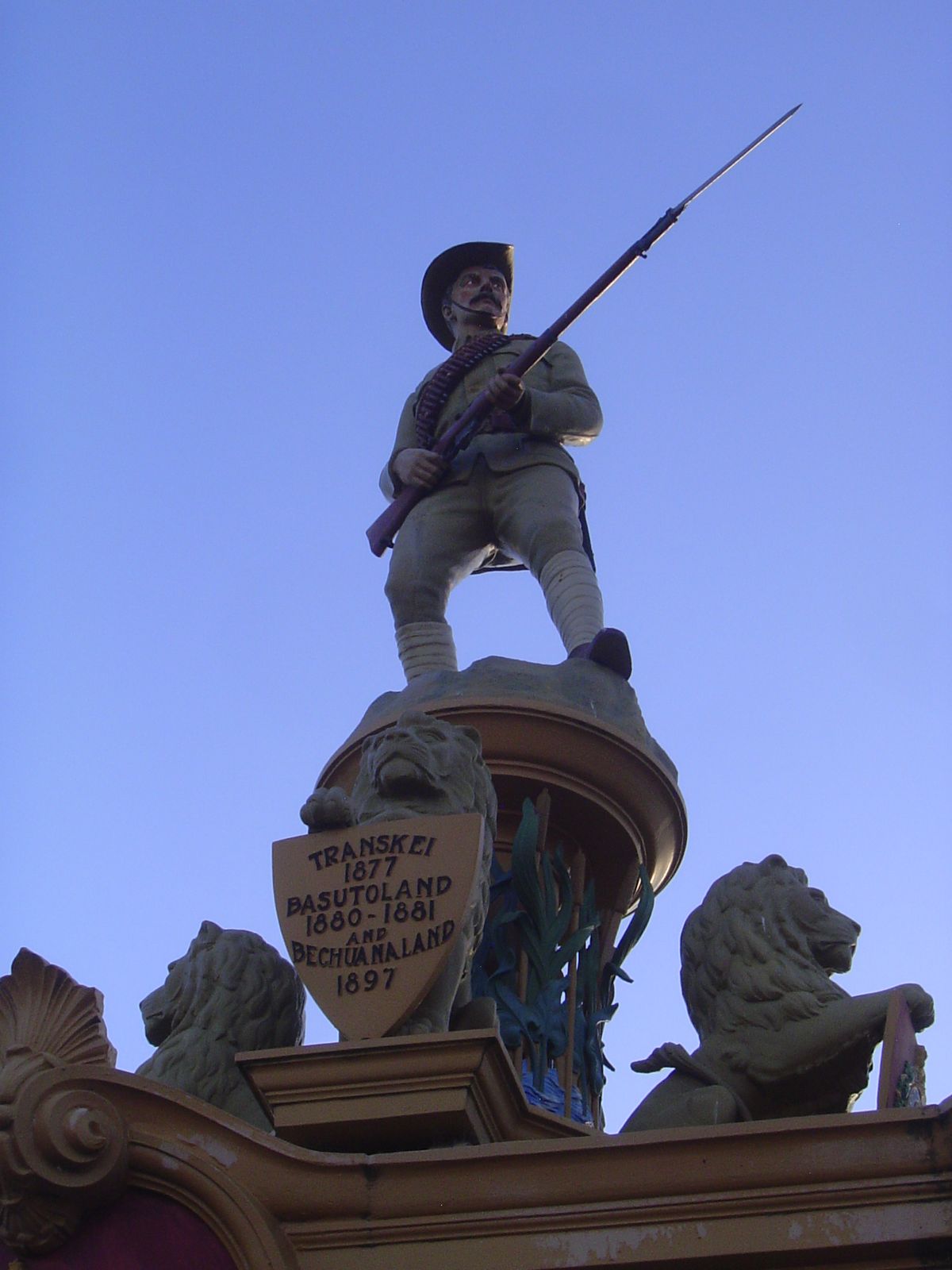 The trooper stands in field-service uniform.