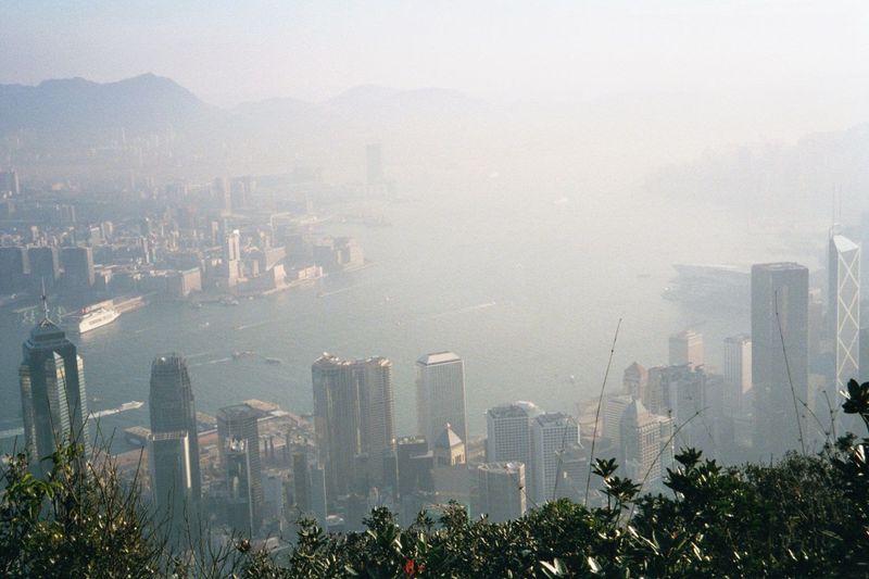 Then, the Star Ferry pier and Victoria Harbour, fairly lost in the smog. Photographs from the mid-1920s show nothing in Hong Kong higher tha