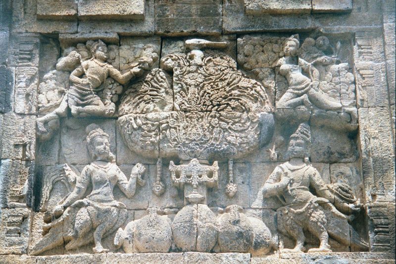 On the outside, handsome and well-preserved kinnaras. They're minor deities, usually shown as half-bird, half-human, and musicians by trade.