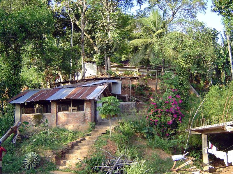 Midway up the stairs, an abandoned rice mill sits in the shack.